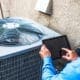 Kevin Robinson's Heating & Cooling | Lancaster, Kershaw, Lugoff, Camden, Indian Land, Heath Springs, SC | Maintenance engineer using digital tablet to inspect air conditioning unit